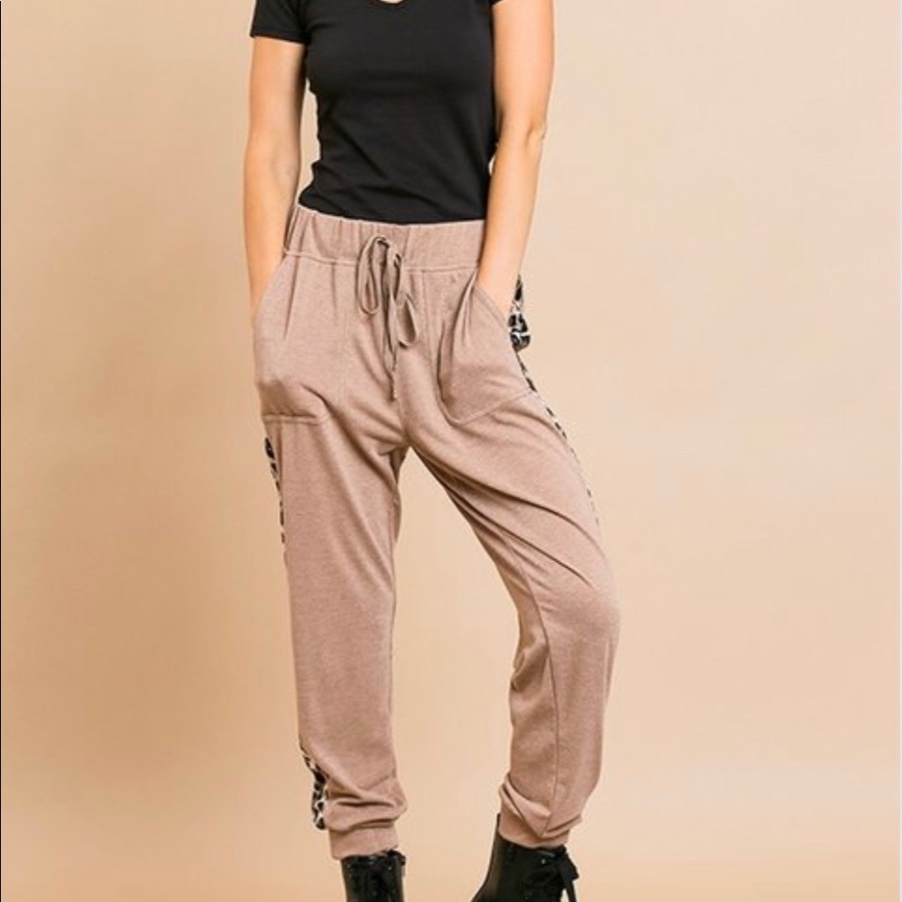 Soft roomy joggers with leopard stripes on sides.